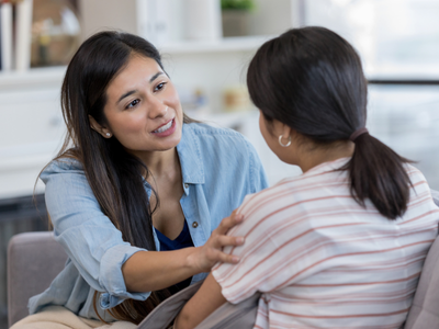 female therapist helping a adolescent with a behavioal heal