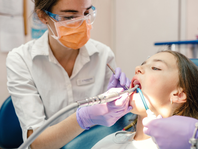 dentist with an adolescent patient